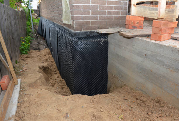Happy homeowners after waterproofing job in Wilson